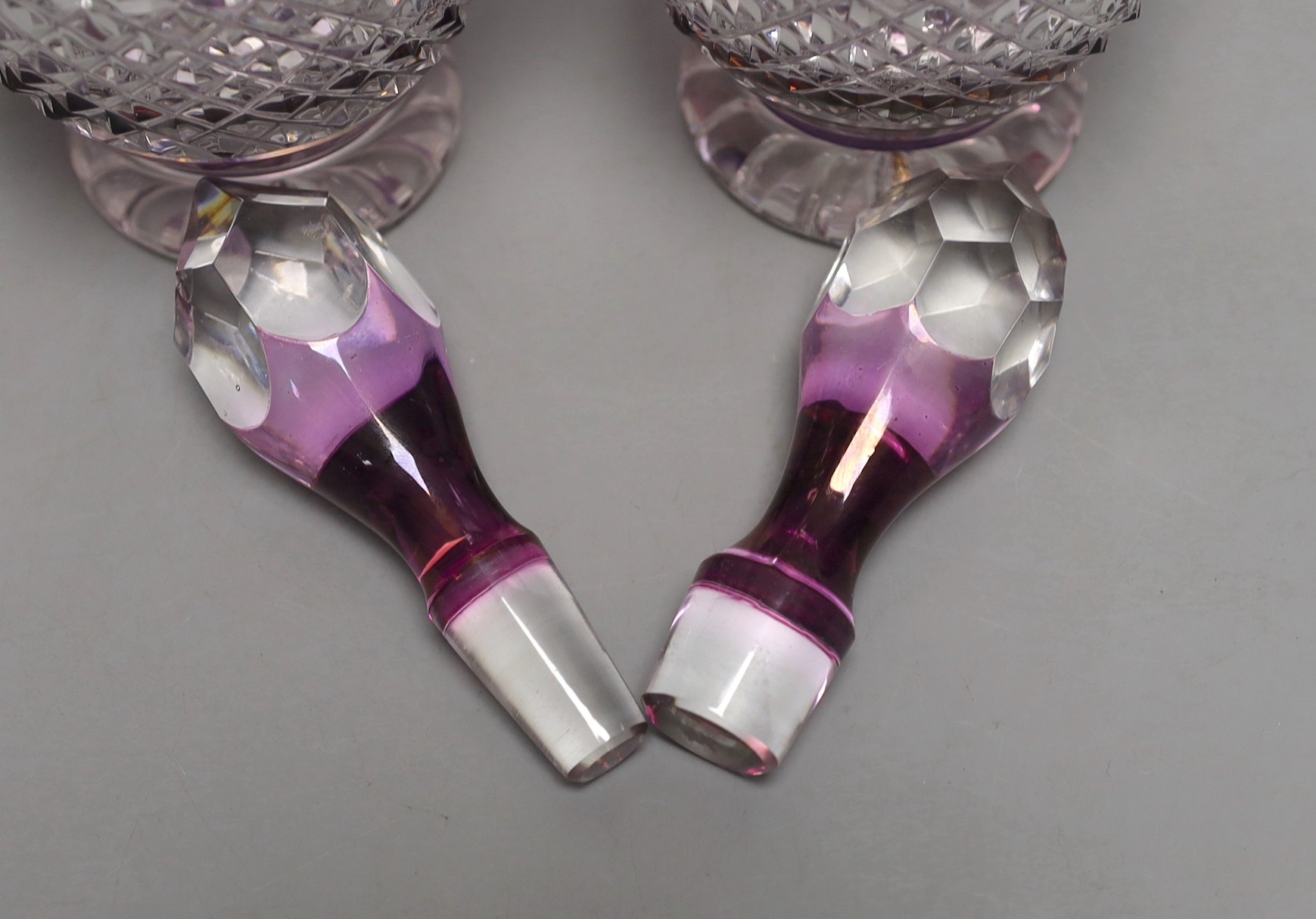 A pair of Bohemian silver mounted cut and amethyst flashed glass decanters and stoppers, 33cm